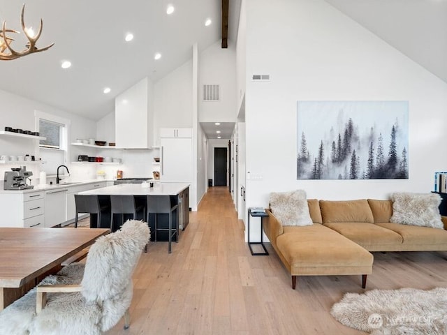 30 Symphony Ct, Cle Elum, WA 98922 - living room featuring high vaulted ceiling, light wood-type flooring, beamed ceiling, and recessed lighting