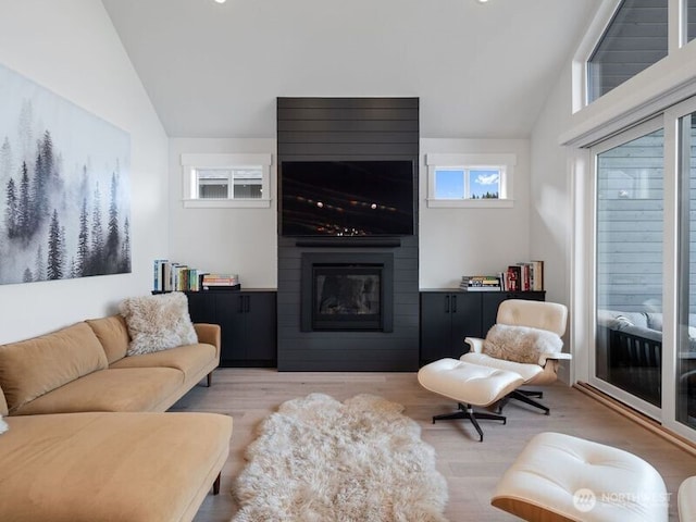 30 Symphony Ct, Cle Elum, WA 98922 - living room with lofted ceiling, a fireplace, and light wood-style flooring