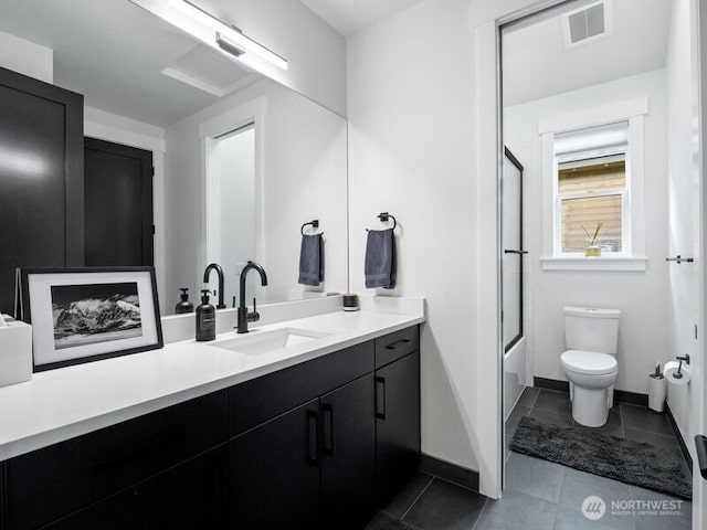 30 Symphony Ct, Cle Elum, WA 98922 - bathroom with vanity, tile patterned floors, and shower / bath combination with glass door