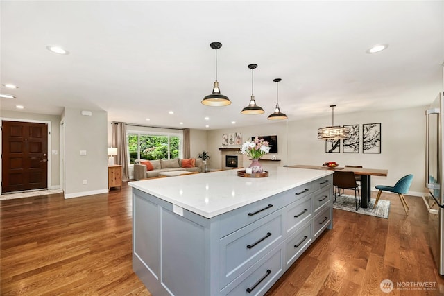 3908 NE 103rd St, Seattle, WA 98125 - kitchen featuring a center island, gray cabinets, recessed lighting, light countertops, and wood finished floors