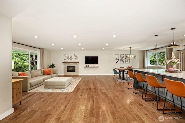 3908 NE 103rd St, Seattle, WA 98125 - living area featuring wood finished floors, recessed lighting, and a glass covered fireplace