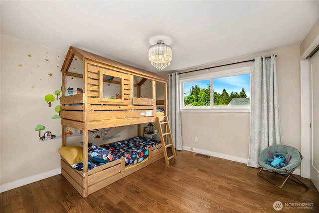 3908 NE 103rd St, Seattle, WA 98125 - bedroom featuring wood finished floors and a chandelier