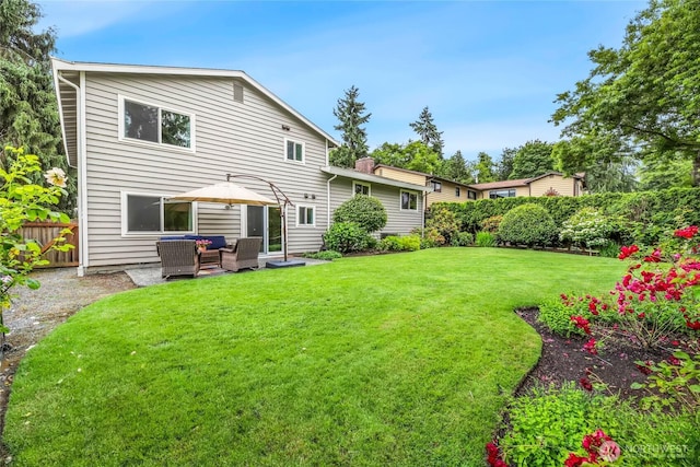 3908 NE 103rd St, Seattle, WA 98125 - back of property featuring an outdoor hangout area and a chimney