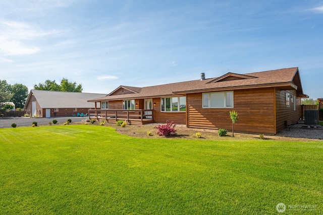 710 S Mckinney Rd, Othello, WA 99344 - ranch-style house with central AC unit, a front yard, covered porch, and roof with shingles