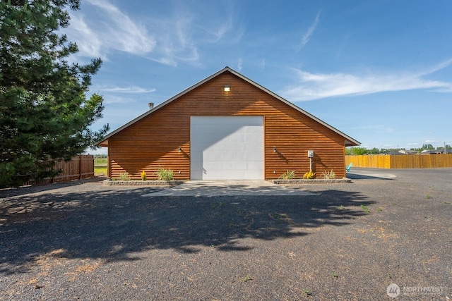 710 S Mckinney Rd, Othello, WA 99344 - view of property exterior featuring a detached garage and an outdoor structure