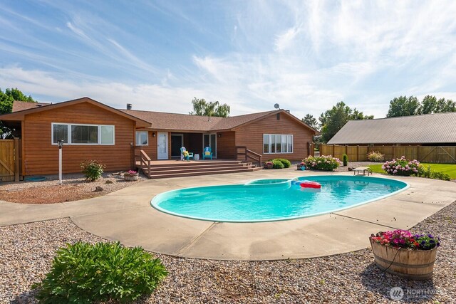 710 S Mckinney Rd, Othello, WA 99344 - view of pool with a wooden deck, a fenced backyard, a diving board, and a patio