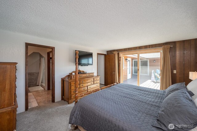 710 S Mckinney Rd, Othello, WA 99344 - carpeted bedroom with access to exterior and a textured ceiling