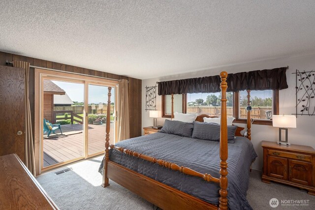 710 S Mckinney Rd, Othello, WA 99344 - bedroom with carpet, access to outside, and a textured ceiling