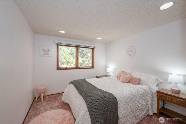 710 S Mckinney Rd, Othello, WA 99344 - carpeted bedroom featuring a textured ceiling and recessed lighting