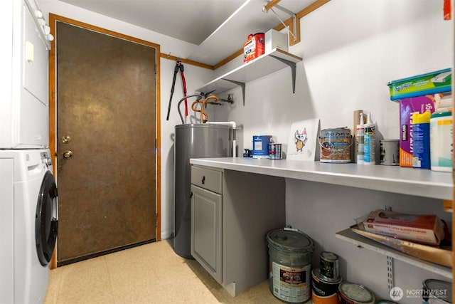 102A Vintin Rd, Carlton, WA 98814 - laundry room featuring stacked washer and clothes dryer, electric water heater, and light floors