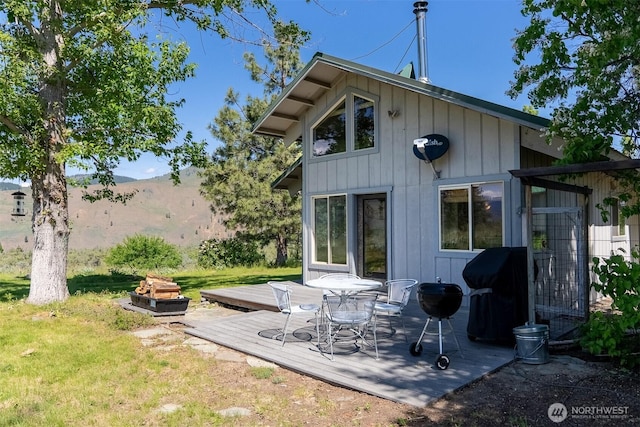 102A Vintin Rd, Carlton, WA 98814 - rear view of property featuring a deck with mountain view and a yard
