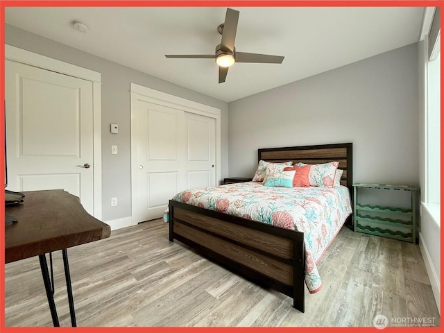 172 Pacific Blvd NW, Ocean Shores, WA 98569 - bedroom with light wood-type flooring, baseboards, a closet, and a ceiling fan