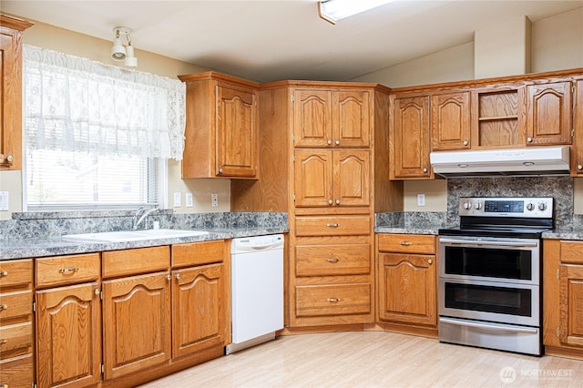 815 NE Karol Loop, College Place, WA 99324 - kitchen with under cabinet range hood, dishwasher, range with two ovens, a sink, and light wood finished floors