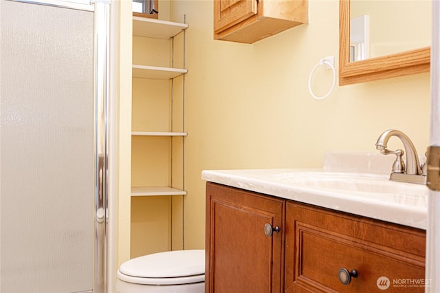 815 NE Karol Loop, College Place, WA 99324 - bathroom featuring vanity, toilet, and an enclosed shower
