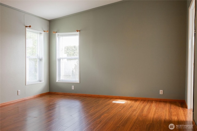 815 NE Karol Loop, College Place, WA 99324 - spare room with wood finished floors and baseboards