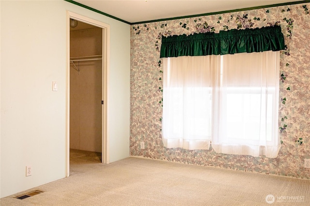 815 NE Karol Loop, College Place, WA 99324 - unfurnished bedroom featuring wallpapered walls, carpet floors, ornamental molding, and a closet