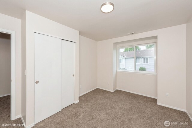10923 63rd St E, Puyallup, WA 98372 - unfurnished bedroom featuring carpet flooring, a closet, and baseboards