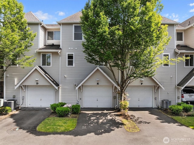 2311 Milton Way Unit E, Milton, WA 98354 - multi unit property with a garage, driveway, and central air condition unit
