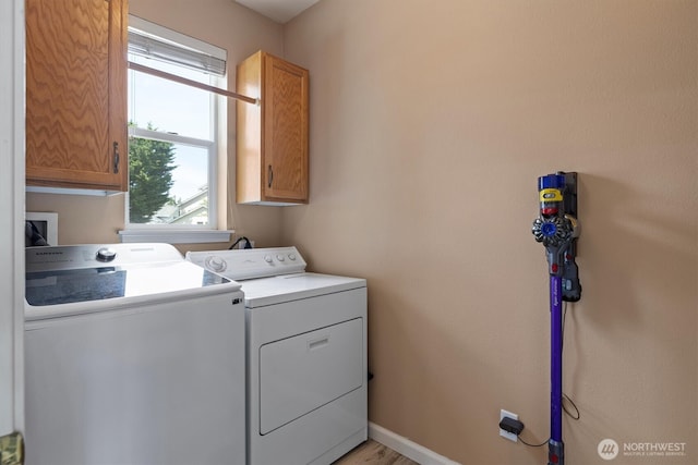 2311 Milton Way Unit E, Milton, WA 98354 - laundry area with cabinet space, washer and dryer, and plenty of natural light