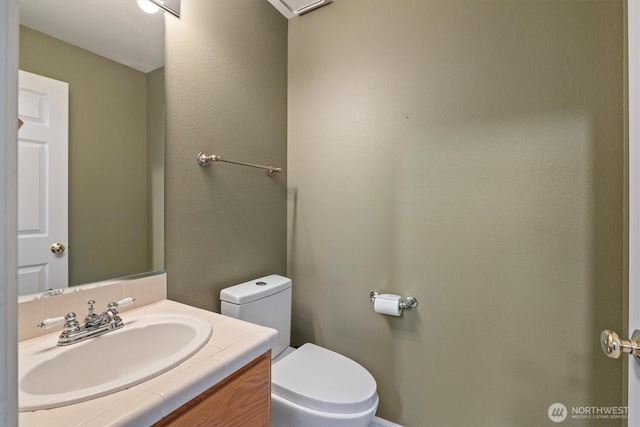 2311 Milton Way Unit E, Milton, WA 98354 - half bathroom featuring toilet and vanity