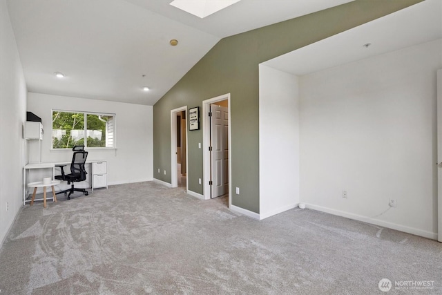 2311 Milton Way Unit E, Milton, WA 98354 - unfurnished office featuring a skylight, lofted ceiling, carpet floors, and baseboards