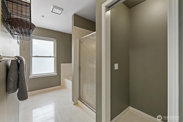 2311 Milton Way Unit E, Milton, WA 98354 - full bathroom with a shower stall, a garden tub, and baseboards
