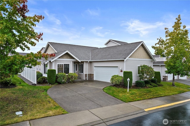 1301 67th St SE Unit 16A, Auburn, WA 98092 - view of front of home with a garage, concrete driveway, and roof with shingles