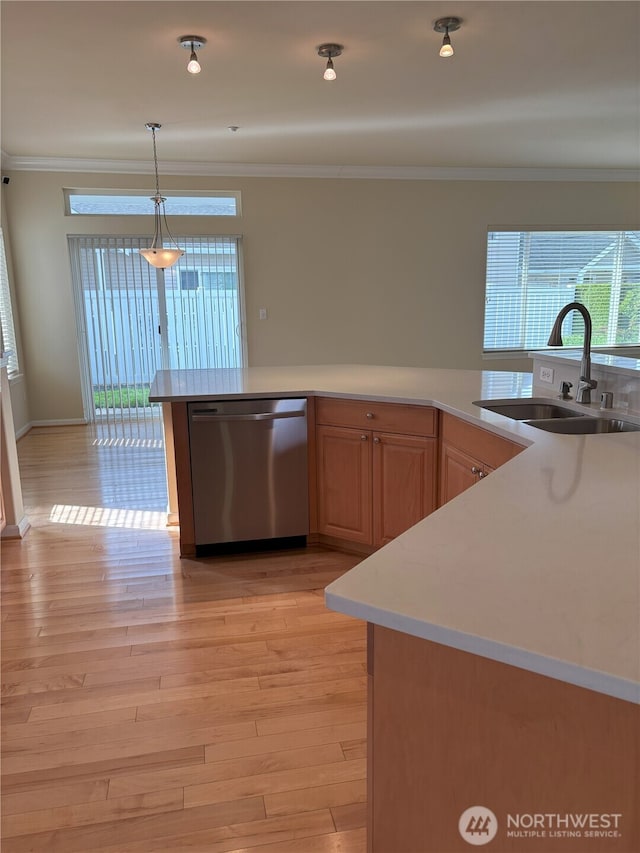 1301 67th St SE Unit 16A, Auburn, WA 98092 - kitchen with dishwasher, a sink, crown molding, pendant lighting, and light wood-style floors