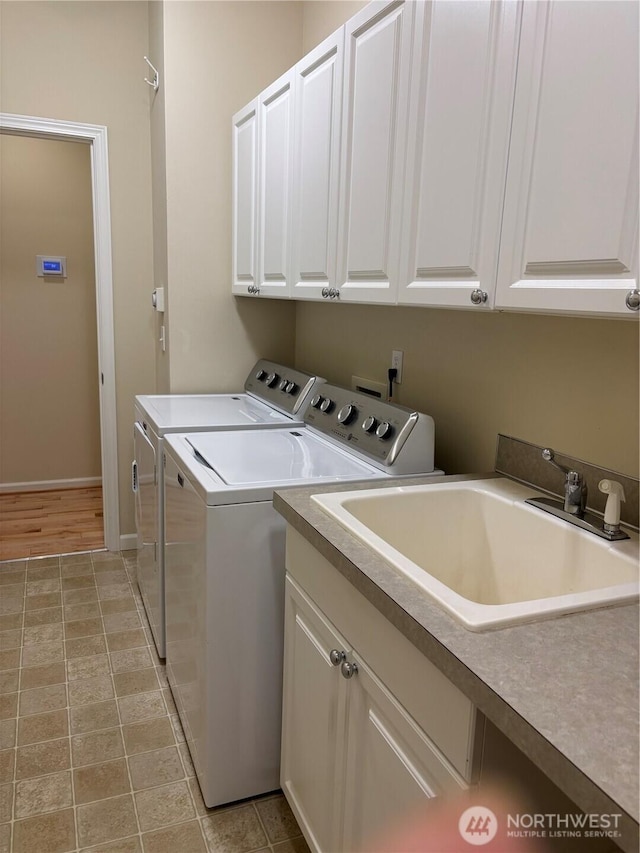 1301 67th St SE Unit 16A, Auburn, WA 98092 - laundry area featuring separate washer and dryer, cabinet space, and baseboards