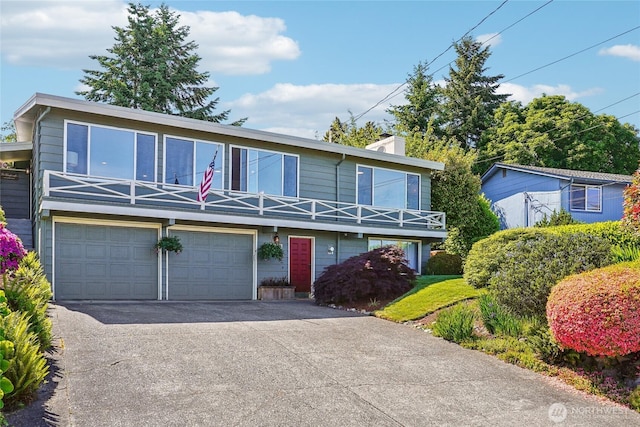 4210 N Vassault St, Tacoma, WA 98407 - view of front of property with a garage and asphalt driveway