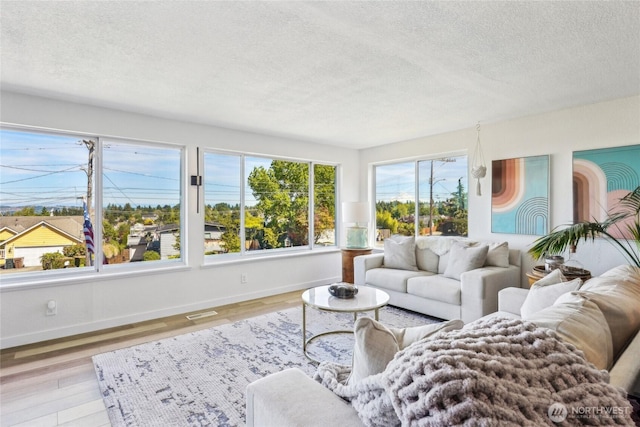 4210 N Vassault St, Tacoma, WA 98407 - living room with a textured ceiling, baseboards, and wood finished floors