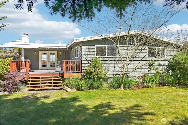 4210 N Vassault St, Tacoma, WA 98407 - rear view of house with french doors, a wooden deck, a yard, and a chimney
