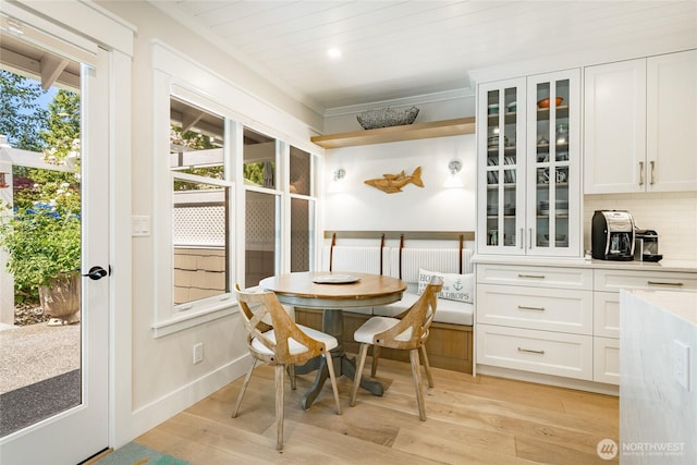 5552 Canvasback Rd, Blaine, WA 98230 - dining space featuring light wood-type flooring, baseboards, and crown molding