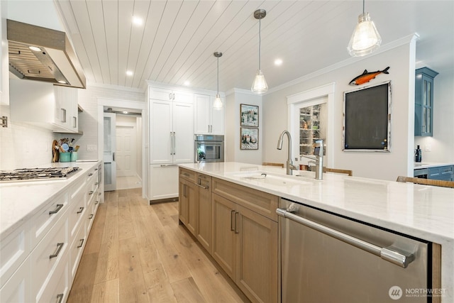 5552 Canvasback Rd, Blaine, WA 98230 - kitchen with appliances with stainless steel finishes, a sink, recessed lighting, range hood, and light wood finished floors