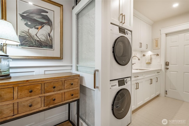 5552 Canvasback Rd, Blaine, WA 98230 - laundry room with stacked washer / dryer and cabinet space