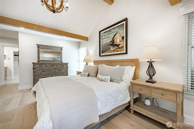 5552 Canvasback Rd, Blaine, WA 98230 - bedroom featuring light wood-style flooring, a chandelier, ensuite bath, and baseboards