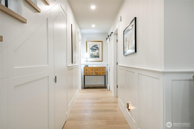 5552 Canvasback Rd, Blaine, WA 98230 - hallway featuring a decorative wall, light wood-style flooring, recessed lighting, and wainscoting