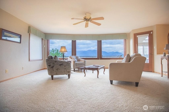 12289 Seabeck Hwy NW, Seabeck, WA 98380 - carpeted living area with a ceiling fan, baseboards, and a mountain view