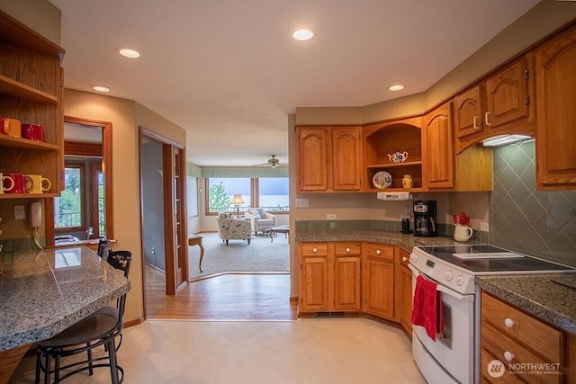 12289 Seabeck Hwy NW, Seabeck, WA 98380 - kitchen featuring open shelves, white range with electric cooktop, brown cabinetry, and recessed lighting