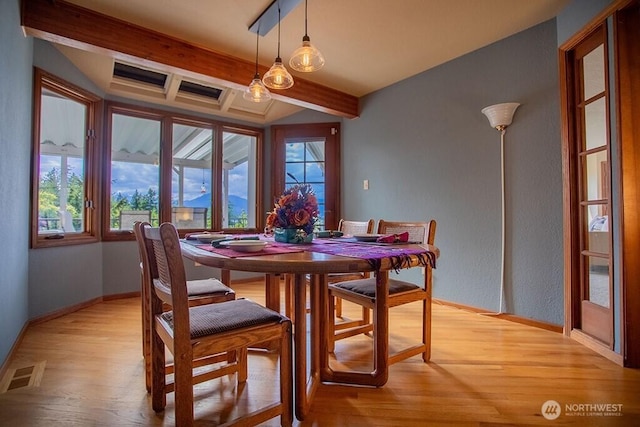 12289 Seabeck Hwy NW, Seabeck, WA 98380 - dining area with light wood finished floors, beamed ceiling, and baseboards