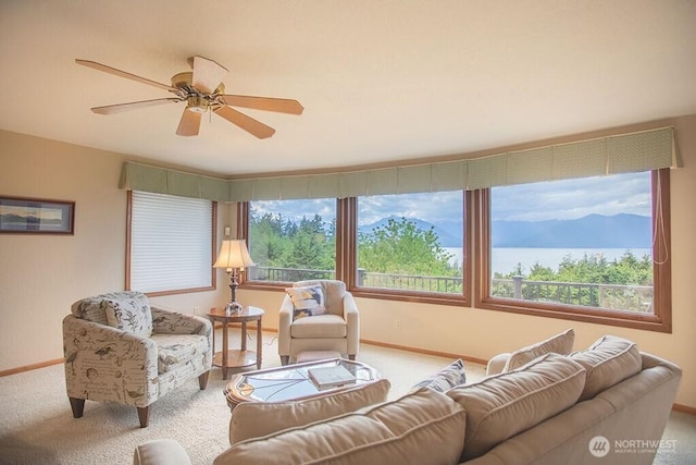 12289 Seabeck Hwy NW, Seabeck, WA 98380 - carpeted living area featuring baseboards and ceiling fan
