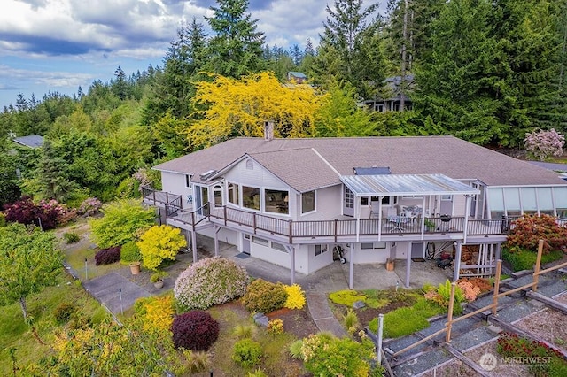 12289 Seabeck Hwy NW, Seabeck, WA 98380 - rear view of property featuring a deck, stairway, and metal roof
