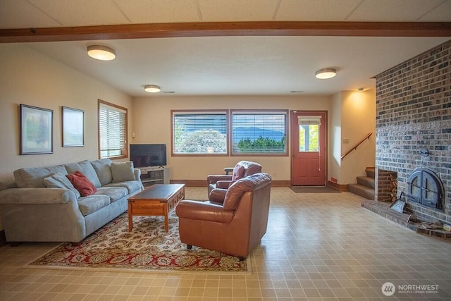 12289 Seabeck Hwy NW, Seabeck, WA 98380 - living room with baseboards, beam ceiling, and stairway