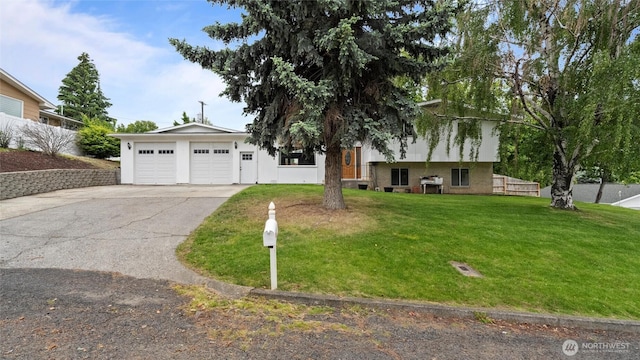 810 E Spring, Dayton, WA 99328 - tri-level home featuring an attached garage, driveway, and a front yard