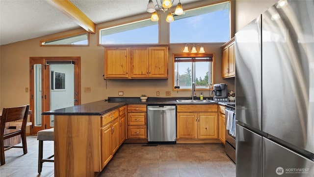 810 E Spring, Dayton, WA 99328 - kitchen with appliances with stainless steel finishes, a sink, a peninsula, a chandelier, and light tile patterned floors