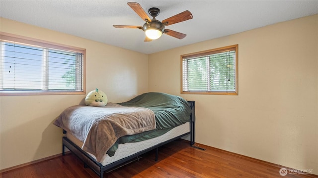 810 E Spring, Dayton, WA 99328 - bedroom featuring wood finished floors, baseboards, and ceiling fan