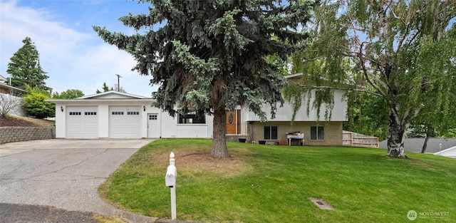 810 E Spring, Dayton, WA 99328 - split level home featuring a front lawn, brick siding, and driveway