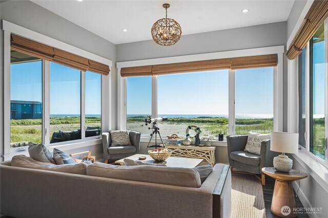 1401 S Cohasset Crst, Westport, WA 98595 - sunroom featuring a chandelier, recessed lighting, and a water view