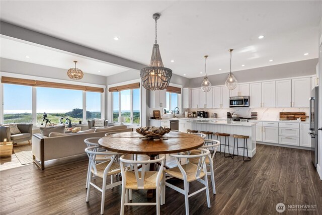 1401 S Cohasset Crst, Westport, WA 98595 - dining space featuring a chandelier, dark wood-style flooring, and recessed lighting