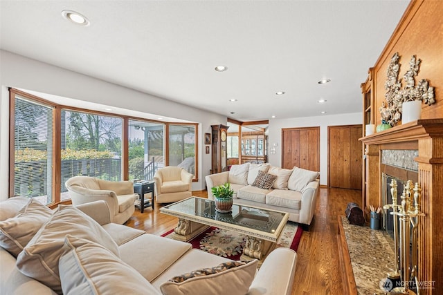9138 Edgewater Dr SW, Lakewood, WA 98499 - living room with recessed lighting, a premium fireplace, and wood finished floors